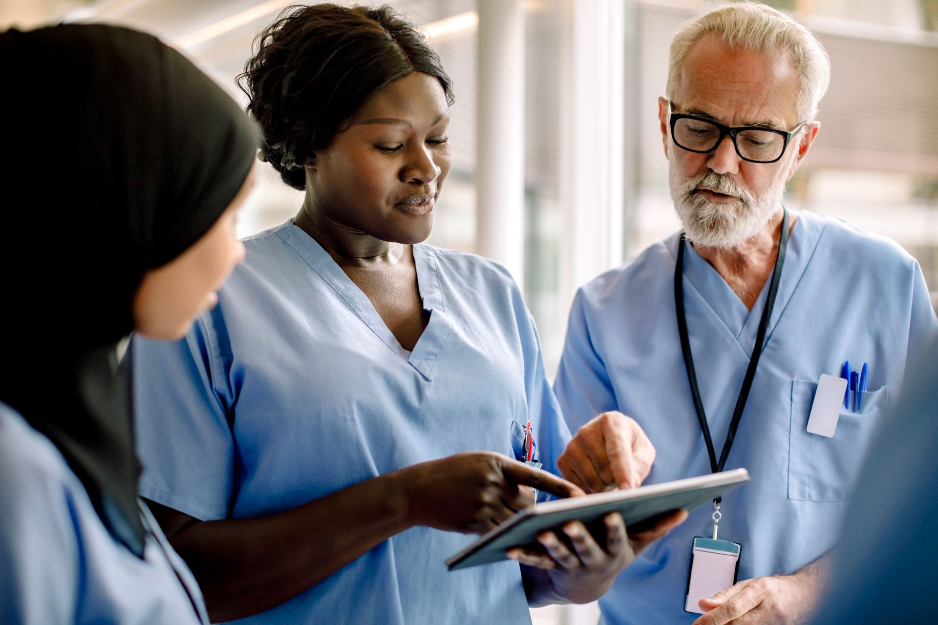 Healthcare professionals looking at ipad